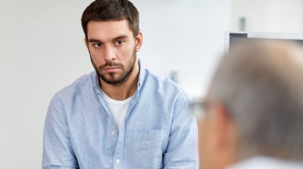 man has one-on-one counseling session