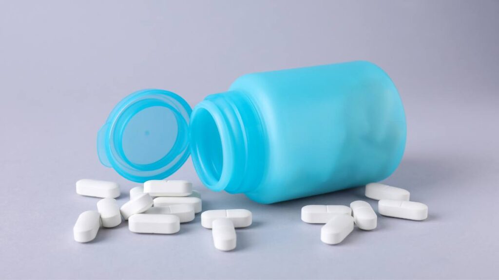 Pills of antidepressants spilling out of bottle. Overdose on antidepressants has been a major concern.