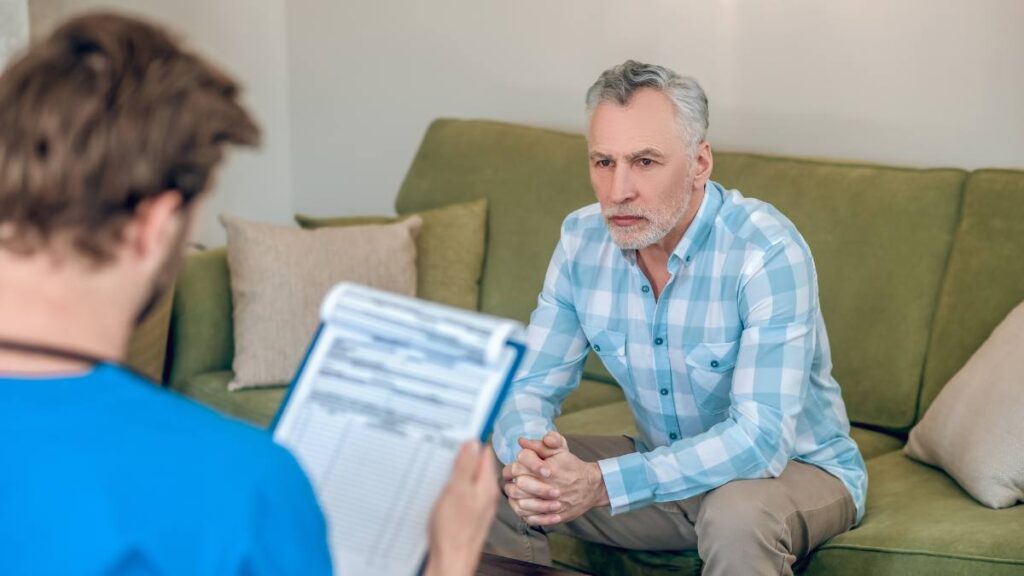 Healthcare professional instructing patient on detox from drugs.